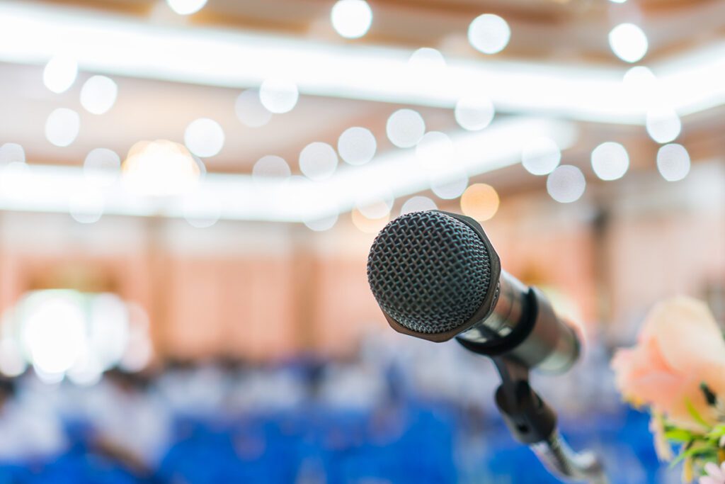 Microphone on stage at a conference event where Dr. Belle provides keynote speaking and professional development workshops