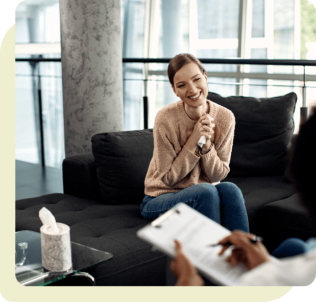A woman smiling and at ease during a faith-based Christian counseling session in Las Vegas with Dr. Belle, licensed marriage and family therapist
