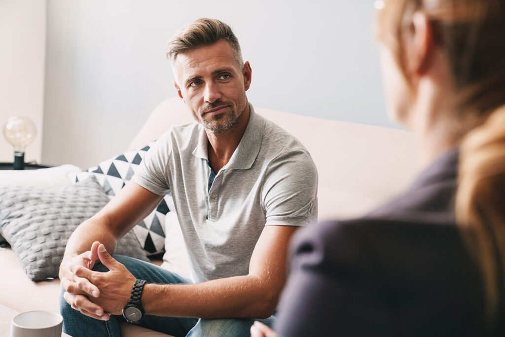 Man sitting in individual counseling session with a therapist in Las Vegas, NV, seeking personal therapy for anxiety, depression, or relationship issues
