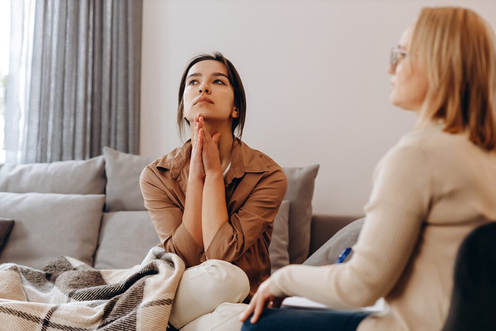 Young woman in a personal therapy session with a female counselor in Las Vegas, NV, seeking individual counseling for anxiety, depression, or trauma healing