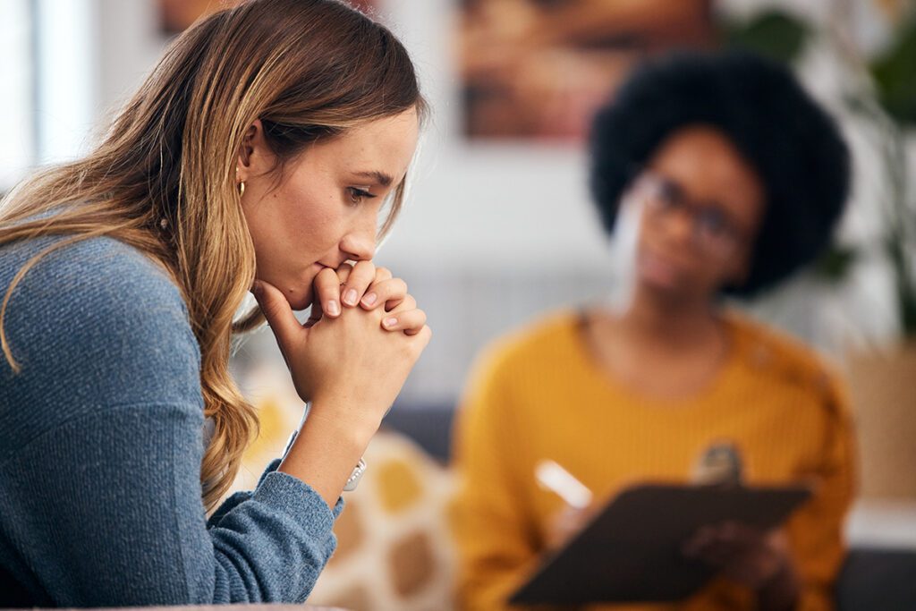 women with therapist thinking